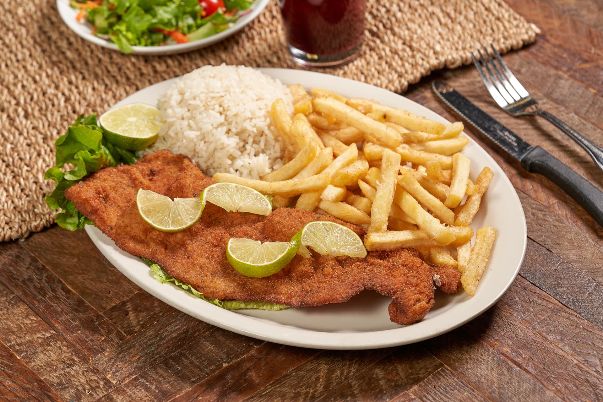 Breaded fish fillet with rice and fries