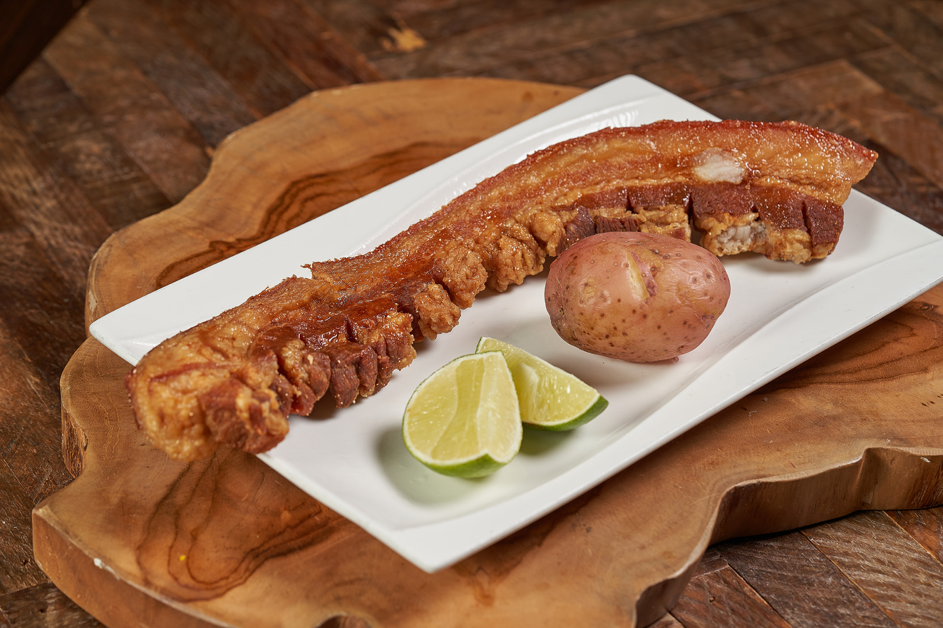 Crispy pork belly with potato and fresh lime